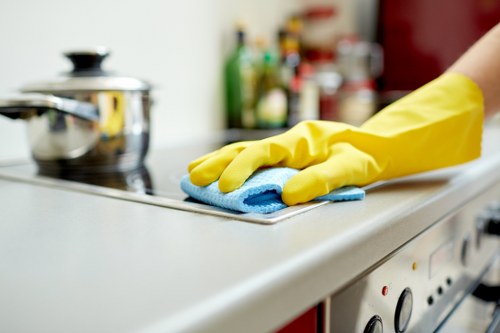 Commercial cleaning team sanitising desks and shared office surfaces