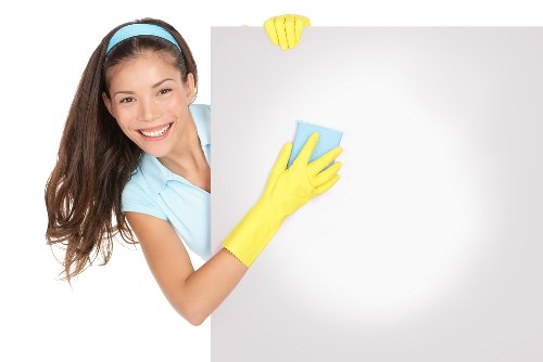 Cleaner assessing room requirements before starting a service