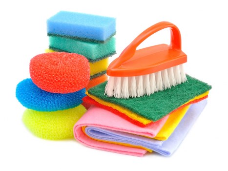 Team member wearing PPE while performing cleaning duties